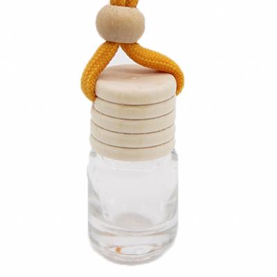 China Non Spill Wholesale Car Wooden Cap Diffuser Empty Hanging Perfume Bottle for sale