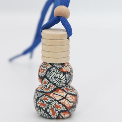 China Non Spill Soft Ceramic Car Cap Wood Hang Rope Perfume Bottle for sale