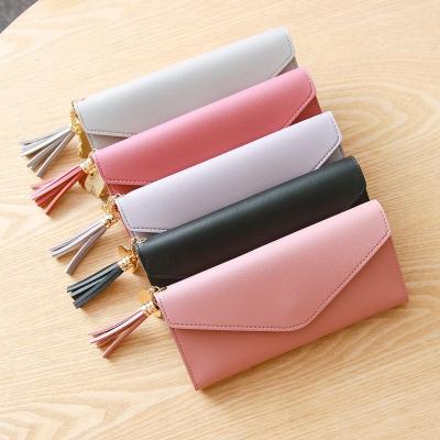 China Newest Fashion Cute Pendant Trend Pure Color Leather Women Waterproof Tassel Purse Wallet for sale