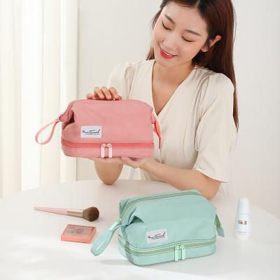 China New Double-Layer Bag Large Capacity Waterproof Simple Nylon Cosmetic Portable Handle Pouch Makeup Bag for sale