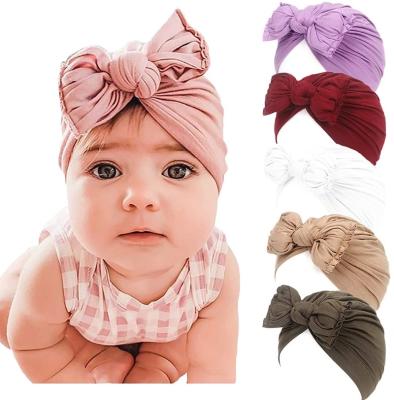 China 2020 Eco-Friendly Beanie Hat Girls Headwear Kids Wrap New Baby Cotton Bow Hat Comfortable Infant Head Accessories Cotton Stretchy Turban Headband for sale