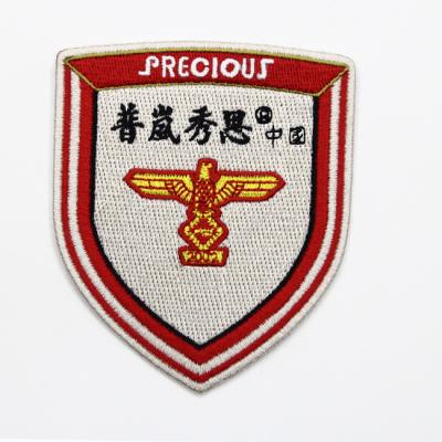 China Viable Cheap Custom Bulk Wholesale 3D Iron On Embroidery Patches And Badges For Apparel for sale