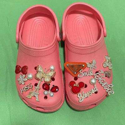 China 2023 Custom Shoe Buckle Designer Brand Logo Croc Clog Designer Shoe Buckle Colorful Crystal Croc Charm Plug Designer Shoe Decoration for sale