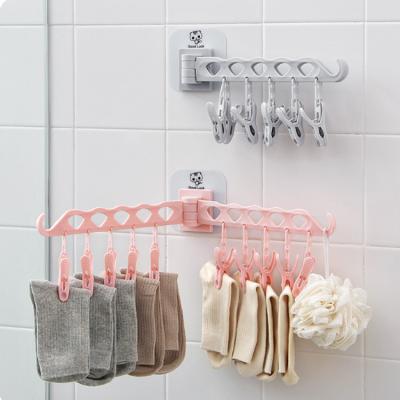 China Detachable Folding Recyclable Multi-Function Non-Marking Sticky Wall Mounted Drying Paste Rack Hanger with Clip for sale