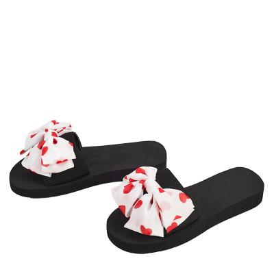 China Hot Selling Fashion Trend Bow Ladies Shape Flat Sandals Women Beach Slipper Luxury Sandals For Women for sale