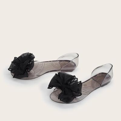 China Fashion Trend Women Summer Jelly Shoes Bow Flat Jelly Hot Selling Transparent Sandal for Ladies and Girls for sale