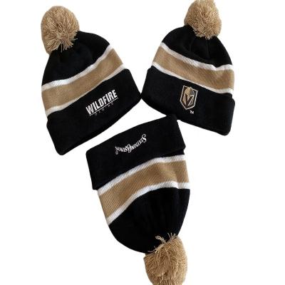 China COMMON cheap adult acrylic knit stripe winter beanie with pom pom for sale