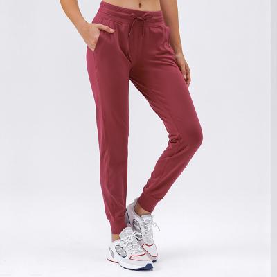 China Breathable Women Gym Pocket Joggers Relax Running Workout Lulu Pants Loose Drawstring Yoga Sweatpants Fitness Leggings for sale