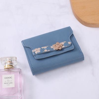 China Fashion Customized Small Pure Color Short Simple Students Ladies Purse Slim Folded Wallet for sale