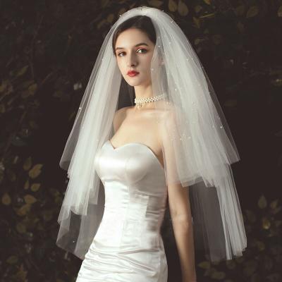 China Solid Single Edge Bead Multi-Layer Veil Folded Puff Style Wedding Dress Bridal Short Veil for sale