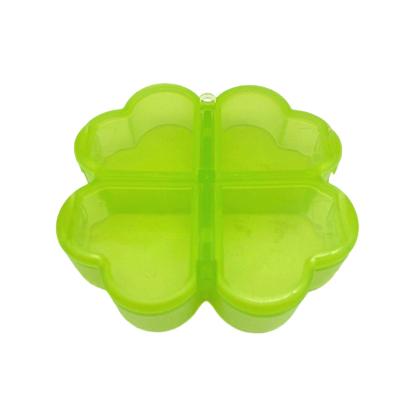 China Plastic Folded Pill Organizer Case Portable Flower Shape Travel 4 Compartments Pill Box for sale