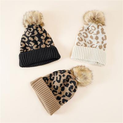 China breathable & waterproof breathable & Fashion casual warm woolen hat net red women knitted hat autumn and winter leopard print hair ball waterproof hat for sale