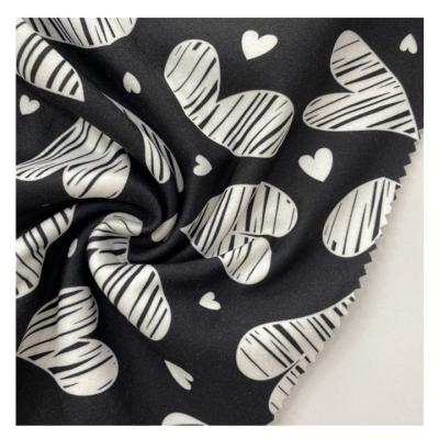 China 2022 New Arrival Viable Hot Sale Wholesale Black Heart Digital Printing Brushed Ribs Dralon Fabric For Garments for sale