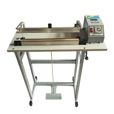 China Food Pass-Through Pedal Sealing Machine With Knife For Cutting And Sealing for sale