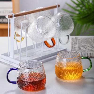 China Contemporary Hot sale 300ml/350ml/280ml Hign Borosilicate hammer Single Wall Glass Tea Cup with handle for sale