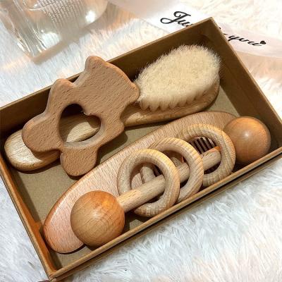 China Natural Eco-friendly Baby Gift Toy Set Wooden Brush and Comb Set Newborn Baby Teethers Baby Rattle Toys Set Sensory Toys for sale