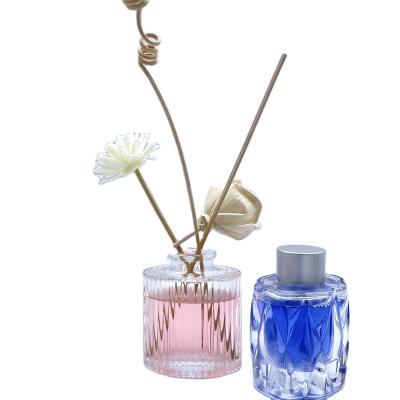 China Luxury 100ml Cosmetic Glass Aroma Oil Bottle With Sprayer Diffuser Bottle Empty Glass Perfume Bottle for sale