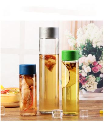 China Beverage Cylinder Round 400ml 500ml Empty Glass Mineral Water Bottle With Plastic Cap For Drinking for sale