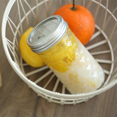 China Hot Sale 500ml Food Round Shape Food Glass Bottle Cut Out Glass Bottle With Screw Cap For Seasoning for sale