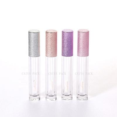 China CAIYA PACK 6ml new cosmetic tube lip gloss container lip gloss cylinder rose gold glitter lid empty cosmetic purple colored clear gloss bottle for sale