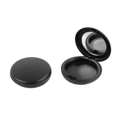 China Recycled Materials Packing Matte Black Pressed Powder Blush Round Compact Case Packing Container With Mirror for sale