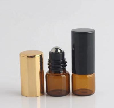 China Wholesale Cosmetic Mini Tan Glass Essential Oil Sample Bottled 1ml Easy To Carry 304 Steel Ball Bottle With Plated Cover for sale