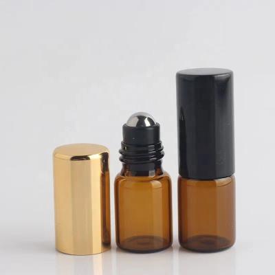 China Wholesale Cosmetic Mini Tan Glass Essential Oil Sample Bottled 2ml Easy To Carry 304 Steel Ball Bottle With Plated Cover for sale