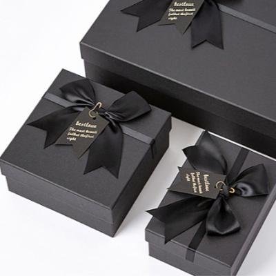 China Handmade Custom Logo Luxury White Magnetic Closure Lid Rose Gold Logo Paper Packaging A5 A4 A3 Size White Gift Box With Ribbon for sale