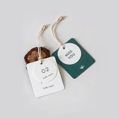 China Sustainable Custom Logo Design Printing Price Label Hangtag For Clothing Store for sale