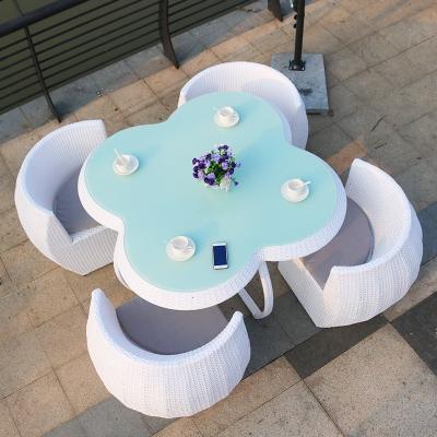 China Modern Unique Outdoor Rattan Furniture Patio Garden Makers Wicker Chair Set Rattan Table Chair Set for sale