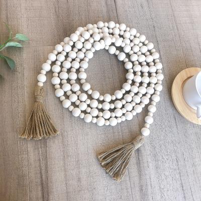 China Custom Europe Wooden Bead Garland Set Beads Tassel Wall Decoration Wooden Beads For Jewelry Making for sale