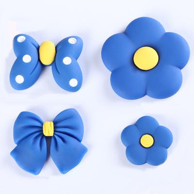 China Europe Hot Sale Klein Series Bow Tie Resin Cabochon Flatback Blue Flower Charms For Hair Clips Phone Case Decoration for sale