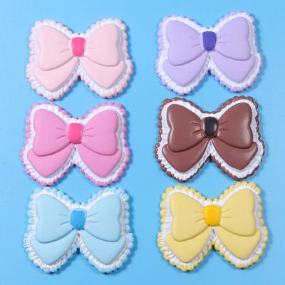 China Europe Kawaii Cartoon Candy Color Resin Bowknot 3d Bow Flat Back Cabochon For Decorations Jewelry Accessory for sale