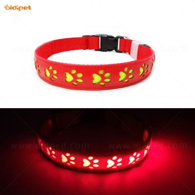 China Reflective Led Flashing Collar Dog Light, Adjustable Paw Hollow Night Safety Led Dog Collar Spike Printing PU Dog Collar for sale