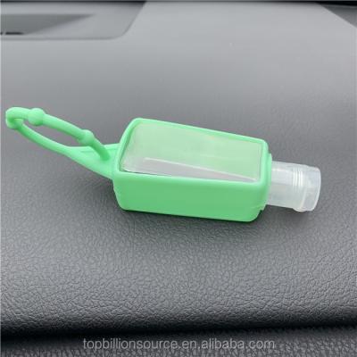 China Fashion Travel 1oz 30ml Empty Plastic PET Bottle Hand Sanitizer With Silicone Holder for sale