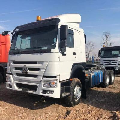 China Brand New Bed Cabin EuroII 371HP Howo Truck Head 6x4 Trailer Trucks Low Price 680*250*340 for sale