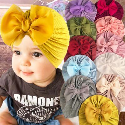 China Beanie Cap Solid Color Bow Baby Turban Hats Eco-Friendly Baby Kids Hat Elastic Baby Headwrap for sale