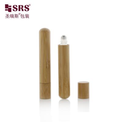 China Round Bottom Cute Essential Oil Roller Steel Ball Bottles Massage No Leakage Natural Bamboo Bottle Glass for sale