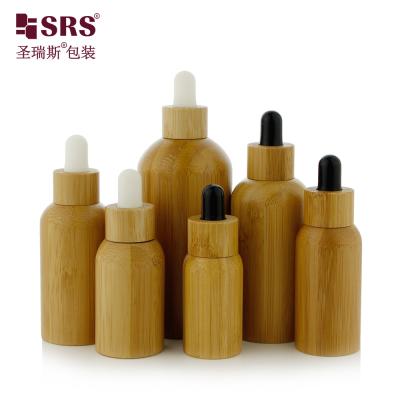 China Botellas interiores de vidrio para aceites esenciales de lujo real de bambú botella goteadora 10ml en venta