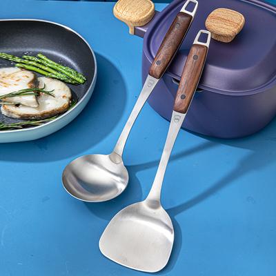 China Durable Stainless Steel Wok Spatula Long Walnut Handle Spoon Can Be Set Customized Kitchen Wooden Spoon Cooking for sale