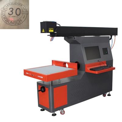 China Water Cooled CO2 Laser Engraving Machine Price Engraving Rotary Stone Machine Device For Laser Marking for sale