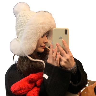 China COMMON fashion winter plus thick warm knitted wool hat women's plush velvet earmuff winter side hats for sale