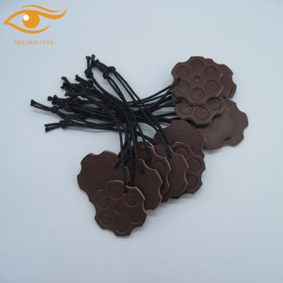 China Durable Debossed PU Leather Hanger Tag for sale