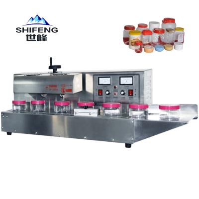 China SF-1800 Desktop Food Bottle Large Diameter Aluminum Foil Honey Plastic Bottle Jar Sealing Machine for sale