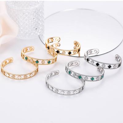 China Durable Luxury Fancy Gold Plated Copper Women Environmental Protection Lucky Four Leaf Clover Open Cuff Bangle Bracelet Jewelry for sale