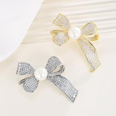 China Durable Wholesale Fashion Elegant Crystal Bow Knot Ribbon Brooch Pin Brooches For Women for sale