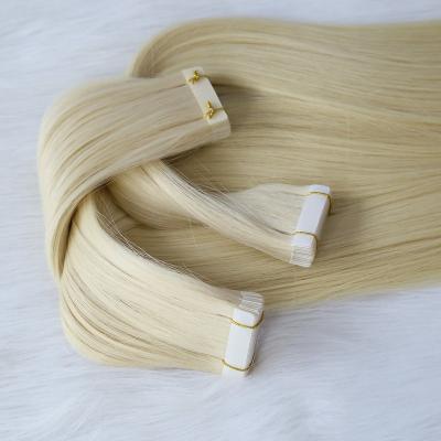 China Natural Russian Premium Quality Virgin Hair 100% Curly Wave 20Inch Tape In Hair Extensions for sale