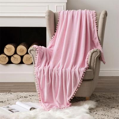 China Mulan 100 Polyester Blanket Flannel Throw Sleeper Office Pompom Tassel Folded Design Soft Solid Customize Fabric Textile 280GSM Hot for sale