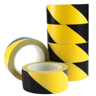 China Yellow PVC Marking Tape Orange Hazard Stripe Line Safety Floor Marking Tape Roll for sale