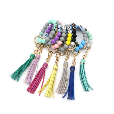 China Food Grade Silicone PU Tassel Fashionable Key Chain Women's Safety Wristband News Keychain Keychain for sale